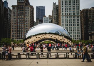 People walk around the Chicago Bean